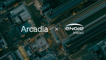 Aerial night-time city view overlaid with Arcadia and ENGIE Impact logos announcing their partnership